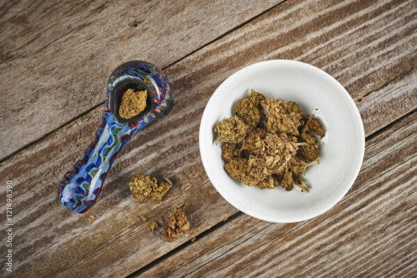 bowl of cannabis with pipe